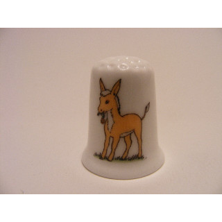 Ezel tekening op een foto op een porselein vingerhoedje