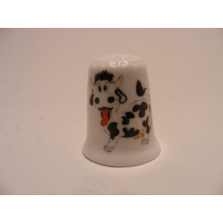 Koe met tong uit zijn bek afbeelding op een porselein vingerhoedje