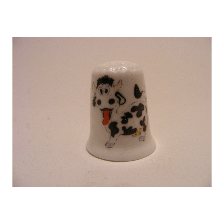 Koe met tong uit zijn bek afbeelding op een porselein vingerhoedje