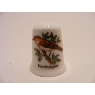 Nachtegaal zangvogel Luscinia megarhynchos op een porselein vingerhoedje