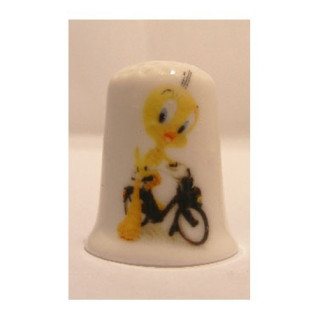Tweety vogel op en solex op een porselein vingerhoedje