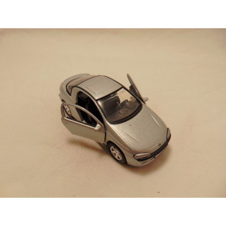 Opel Tigra Tins Toys 1:38 zilverkleurig