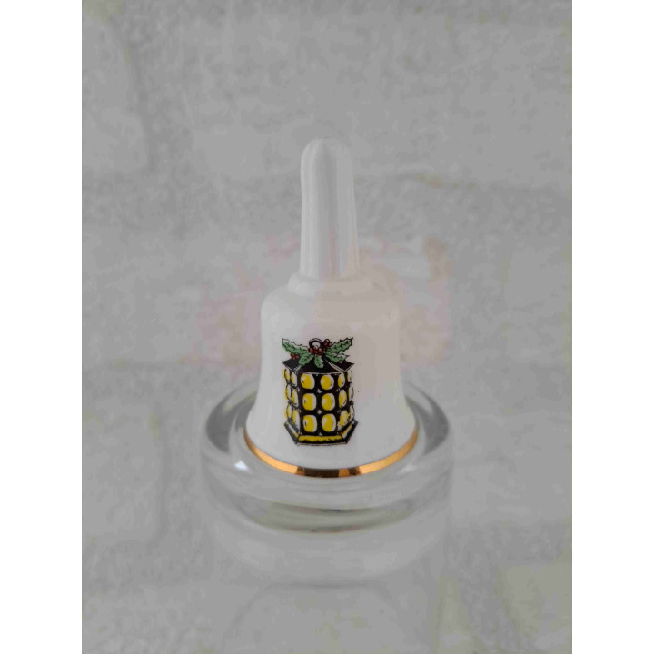 Porselein tafelbelletje met een kerstmislampion opdruk