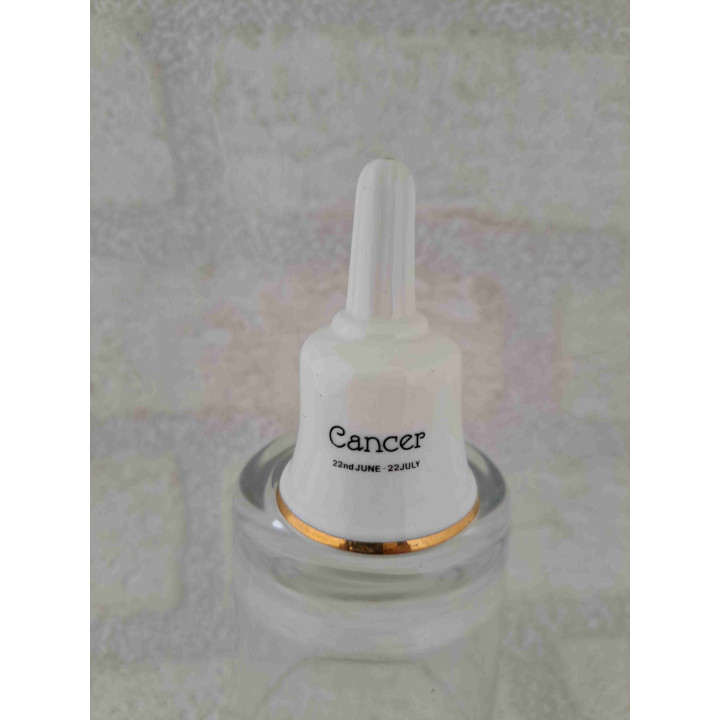 Porselein tafelbelletje met een goudkleurig kreeft sterrenbeeld opdruk