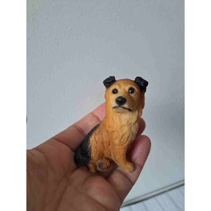 Duitse herder puppy hond zittend op de grond van kunsthars
