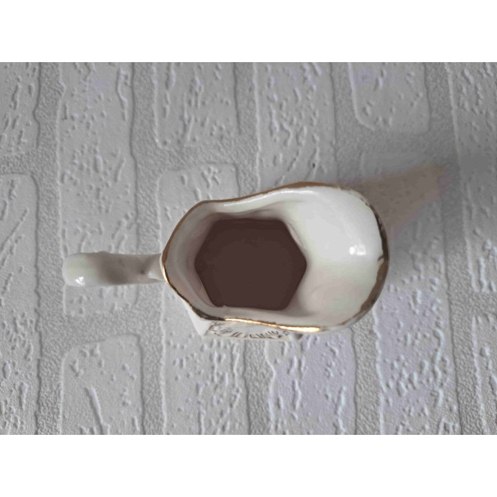 Melkkan van porselein met graan opdruk