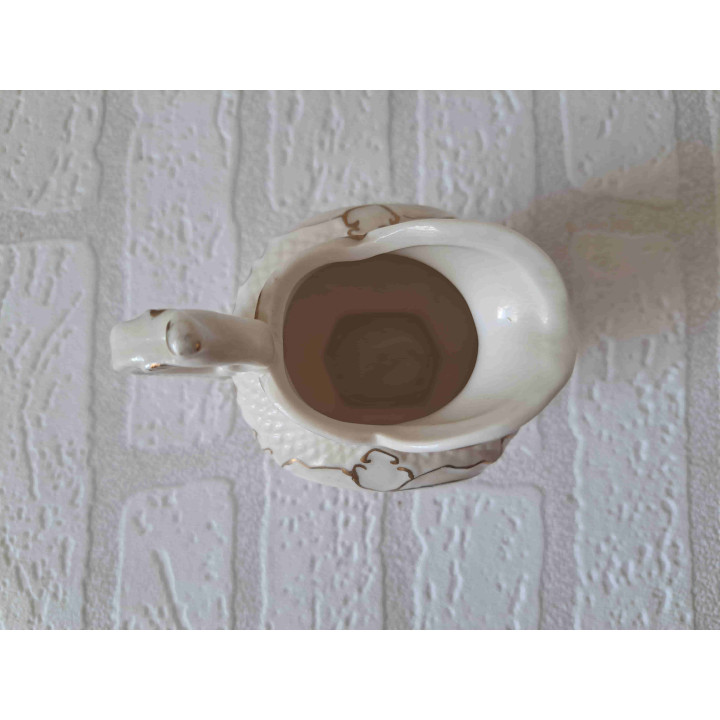 Melkkan van porselein met fruit opdruk