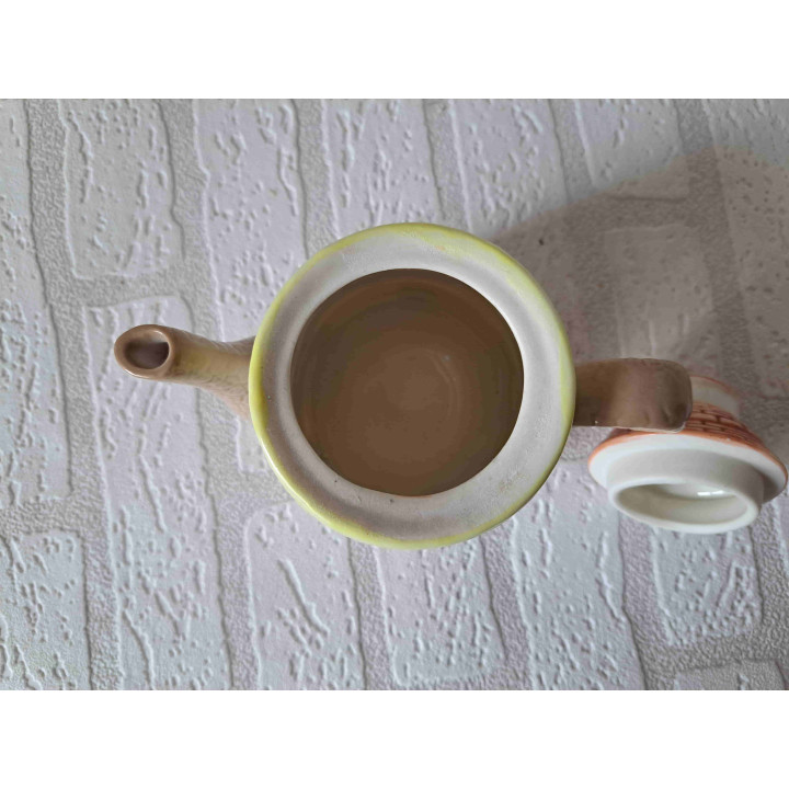 Theepot in een vorm van een ronde huis