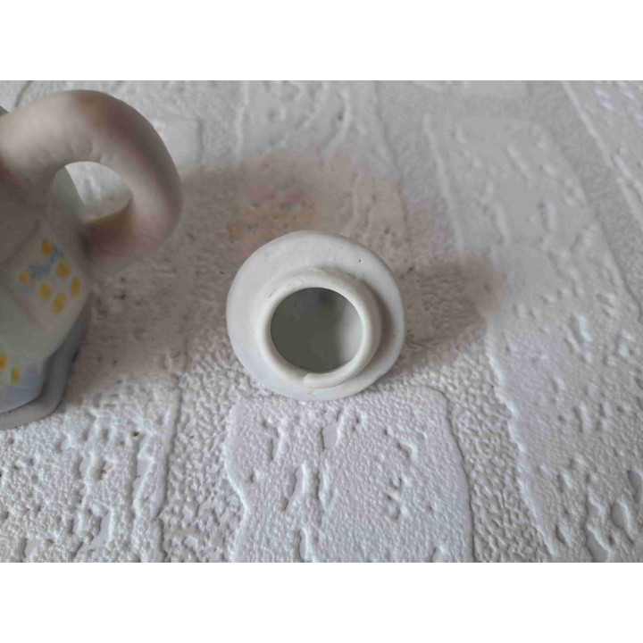 Theepotje in een vorm van een huisje