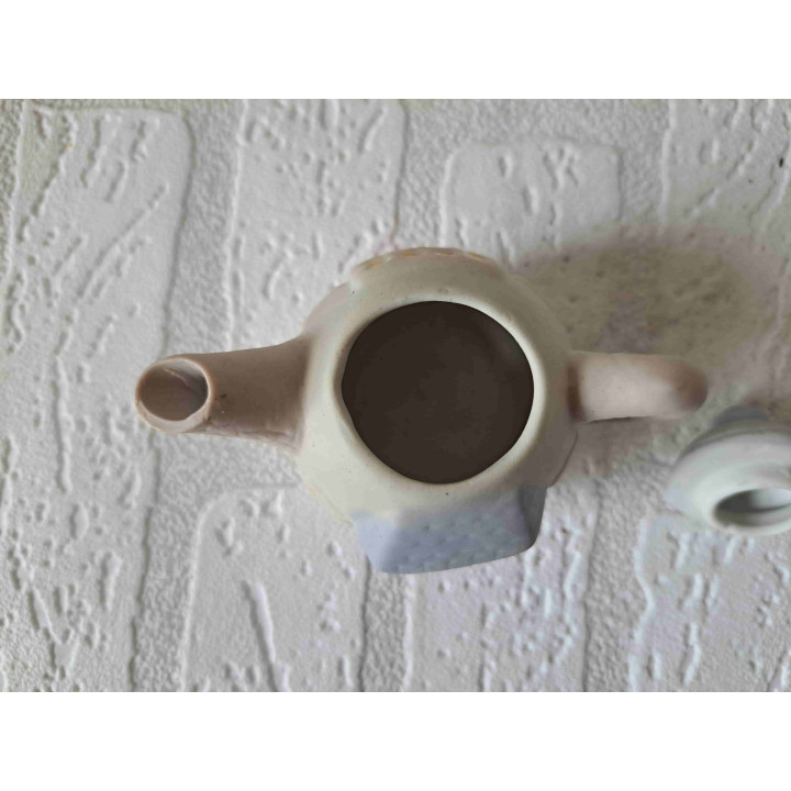 Theepotje in een vorm van een huisje