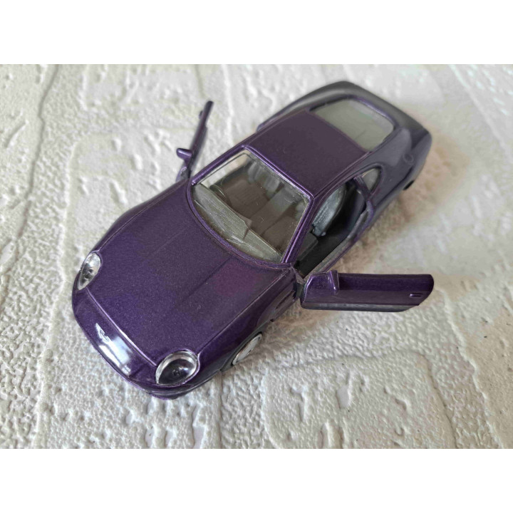 Aston Martin DB7 Maisto Shell 1:40 paars - modelauto