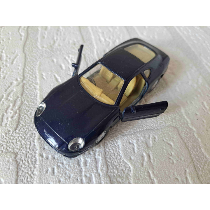 Aston Martin DB7 Maisto Shell 1:40 donkerblauw - modelauto