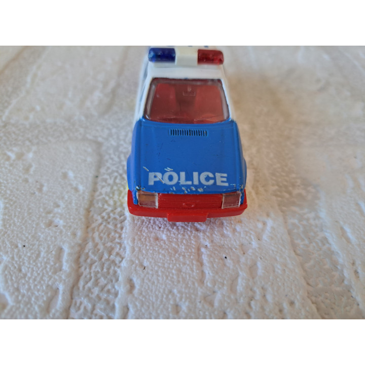 Ford Escort 1.6i Police 1:64 Maisto - modelauto