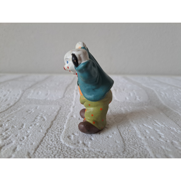Clown van porselein verstopt zijn paraplu 4x3.5x6.5cm