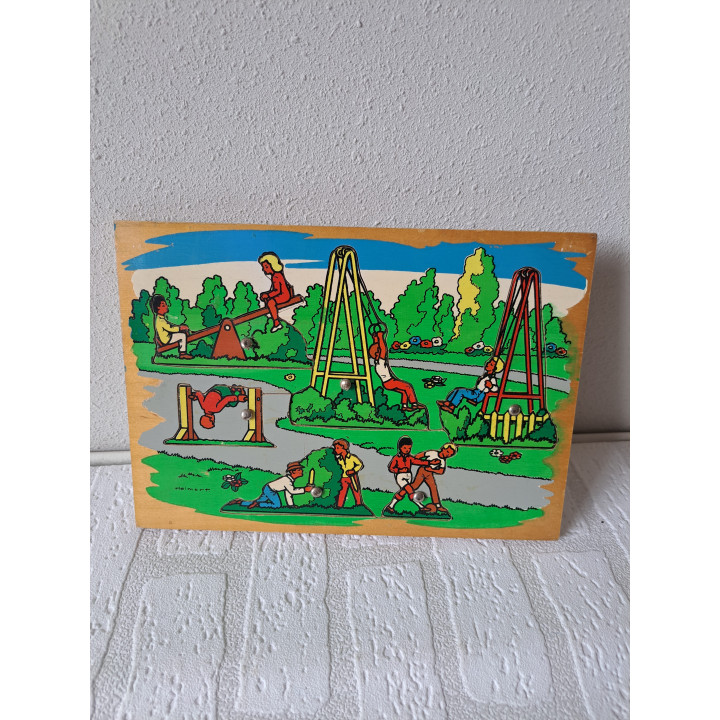 Houten dopjes puzzel met buiten taferelen 25x17.5x1cm