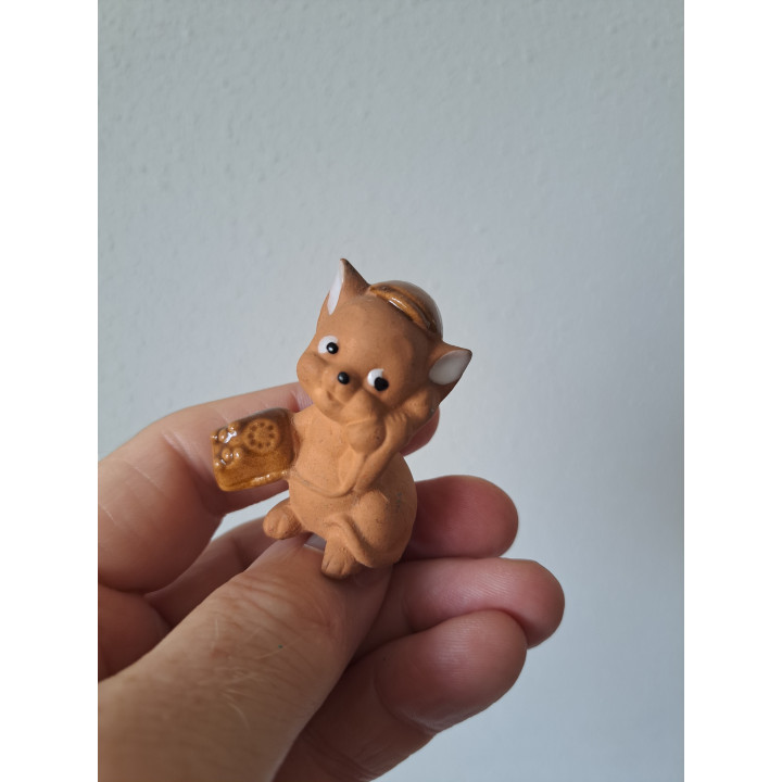 Muis van keramiek met telefoon 4x2.5x5.5cm