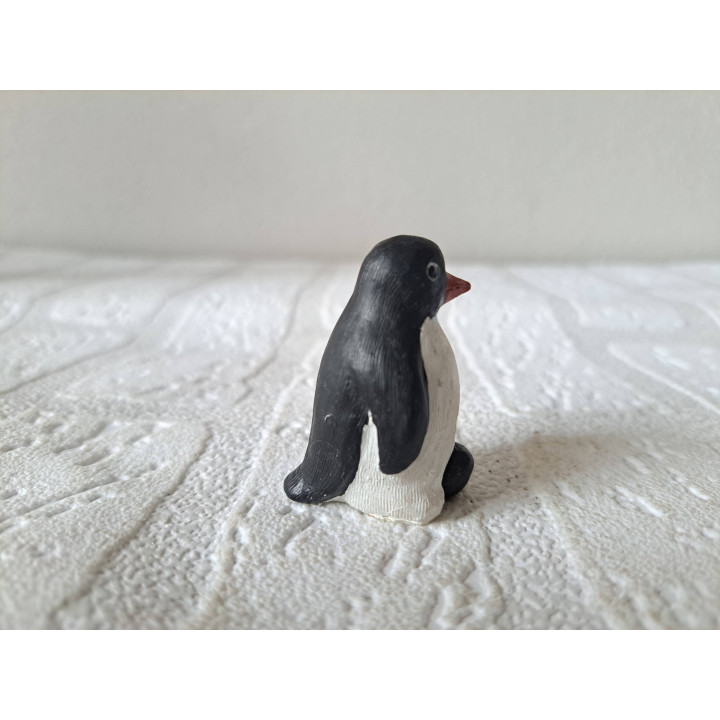 Pinguïn van kunsthars met jong 2.5x3x4.5cm - dierfiguren