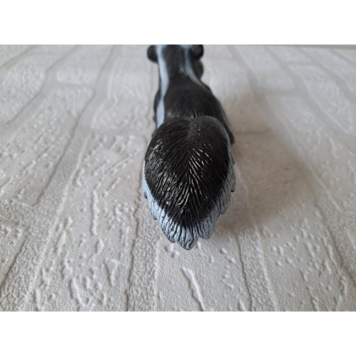 Stinkdier van hard rubber voor buiten op te hangen 18x6x6cm - tuin