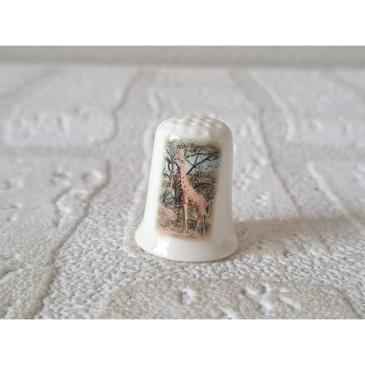 Giraffe eet blaadjes vingerhoedje