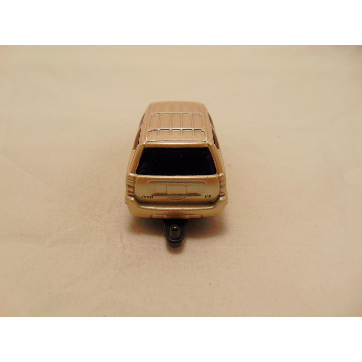 Jeep Grand Cherokee 2002 1:53 Maisto goudkleurig