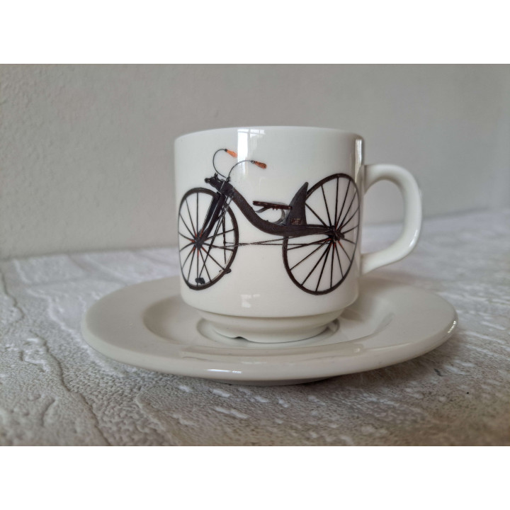 Kop en schotel met Macmillan fiets, porselein D13xH8cm - handgemaakt