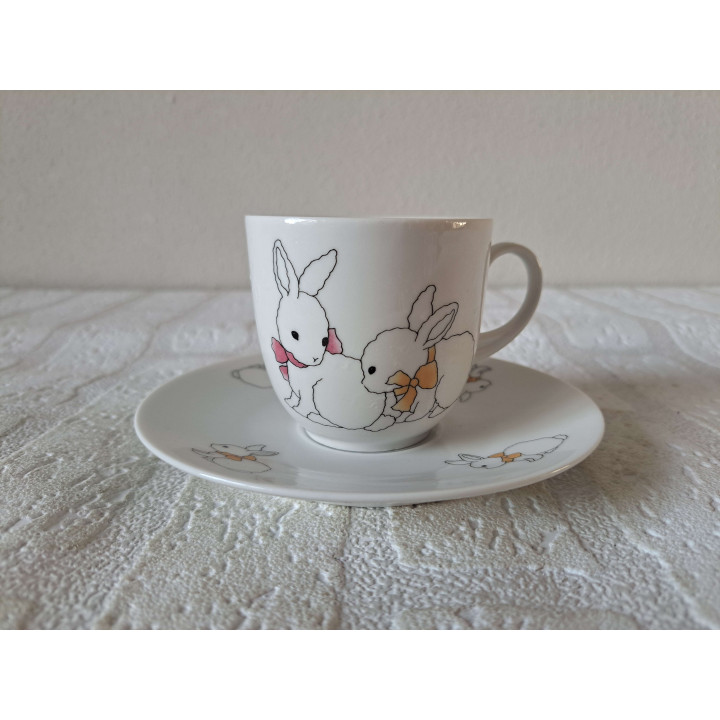 Kop en schotel met konijnen, porselein D13.5xH7cm - handgemaakt