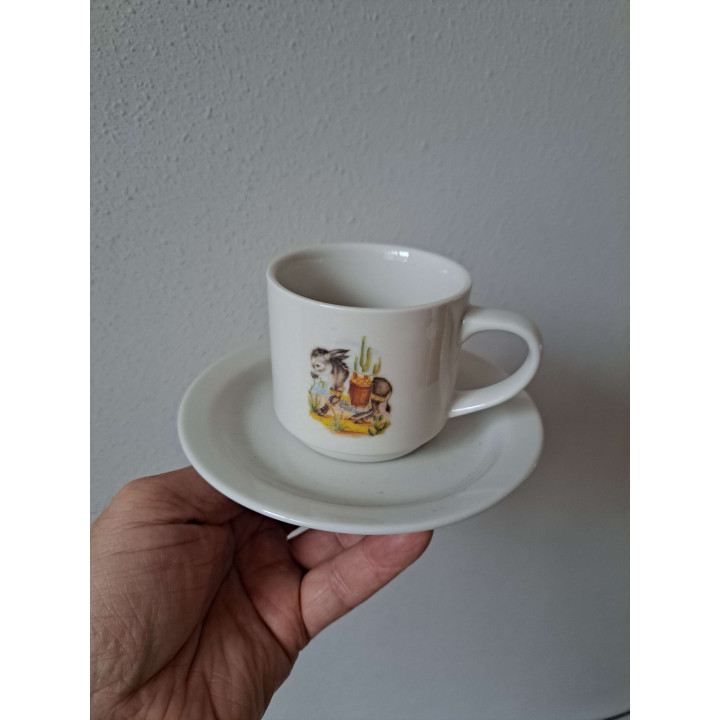 Kop en schotel met Ezel met mand, porselein D14x7.5cm - handgemaakt