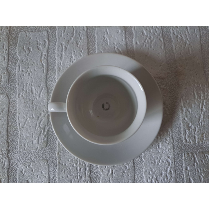 Kop en schotel Ezel met mand porselein D13.5x7.5cm - handgemaakt