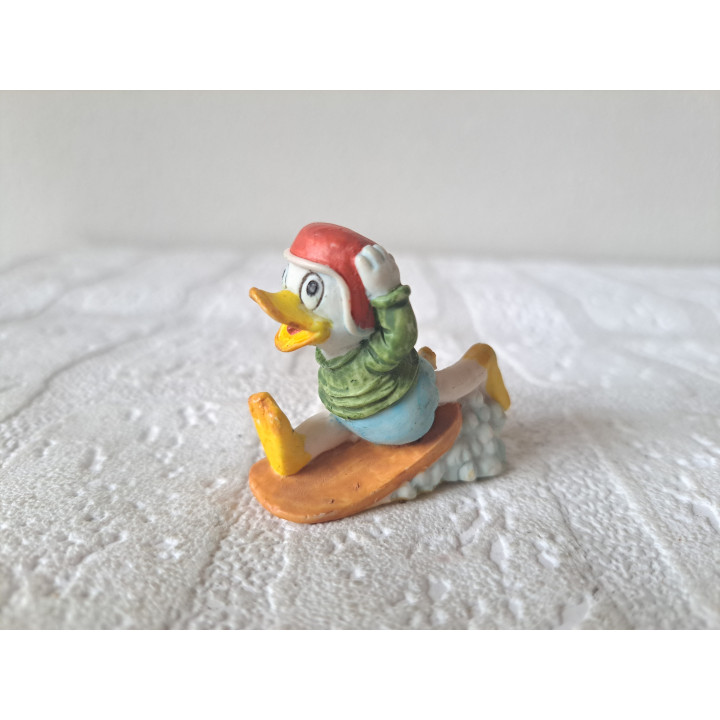 Kwak met surfplak, Donald Duck, Disney, kunsthars 5x2x4.5cm - disney