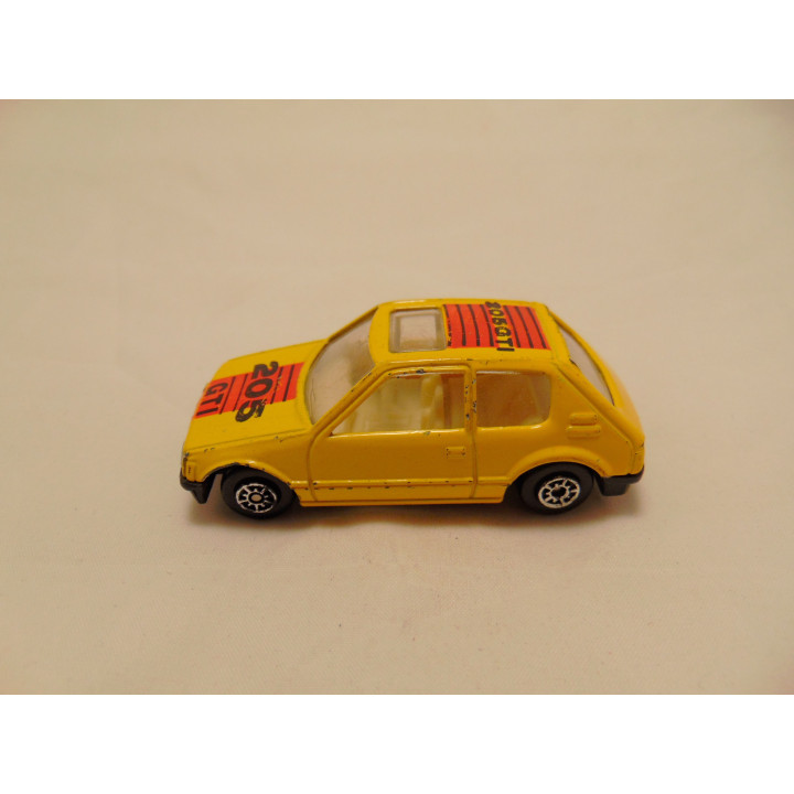 Peugeot 205 GTI met sunroof 1:64 MC Toys geel